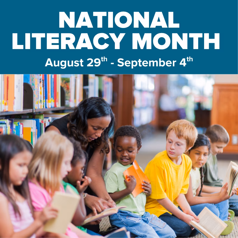 Promotional graphic for National Literacy Month at DISCOVERY Children's Museum, August 29–September 4, featuring an adult reading with a group of children seated in a library.