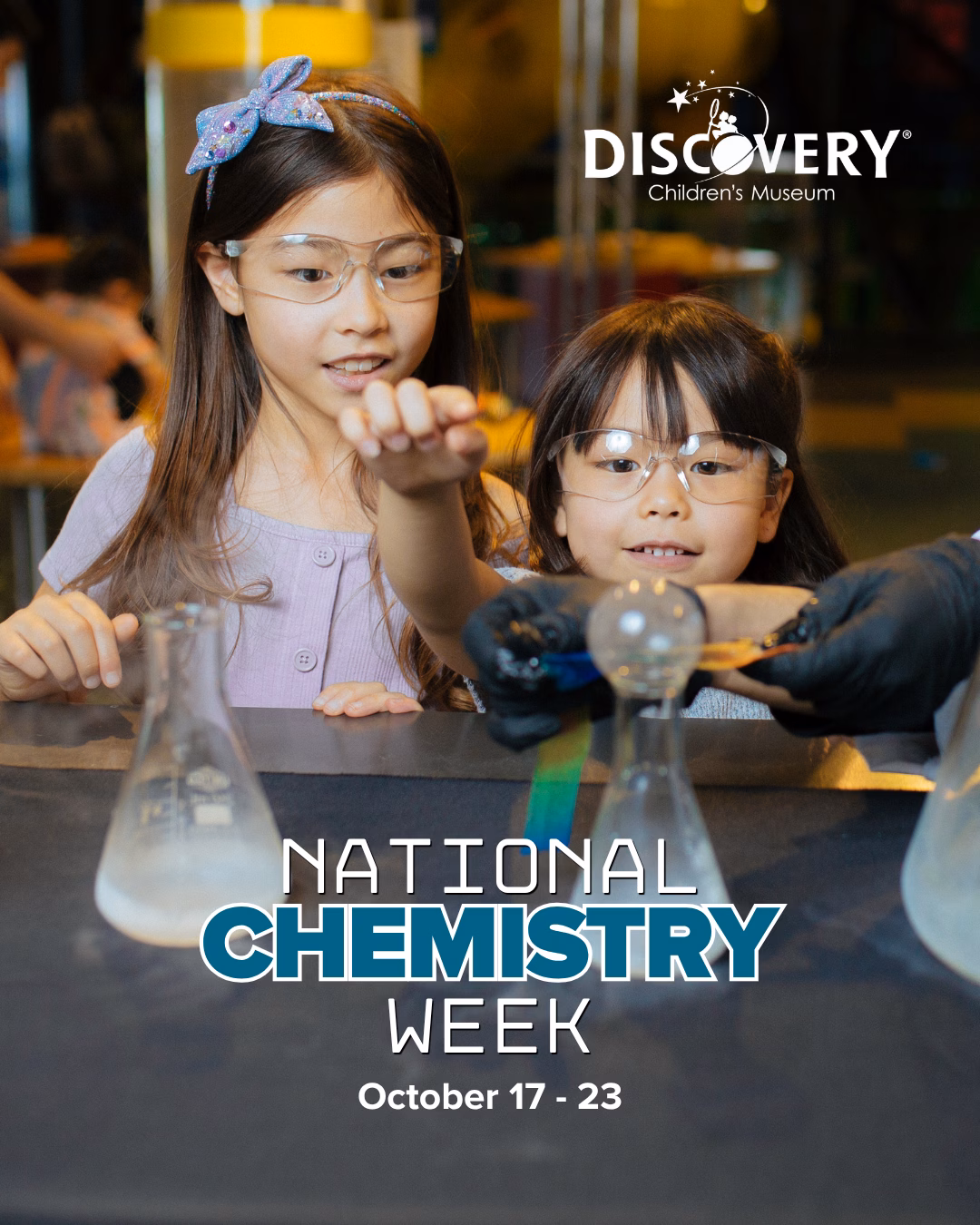 Promotional graphic for National Chemistry Week at DISCOVERY Children's Museum, October 17–23, featuring two children and a museum educator conducting a chemistry experiment with beakers and flasks.